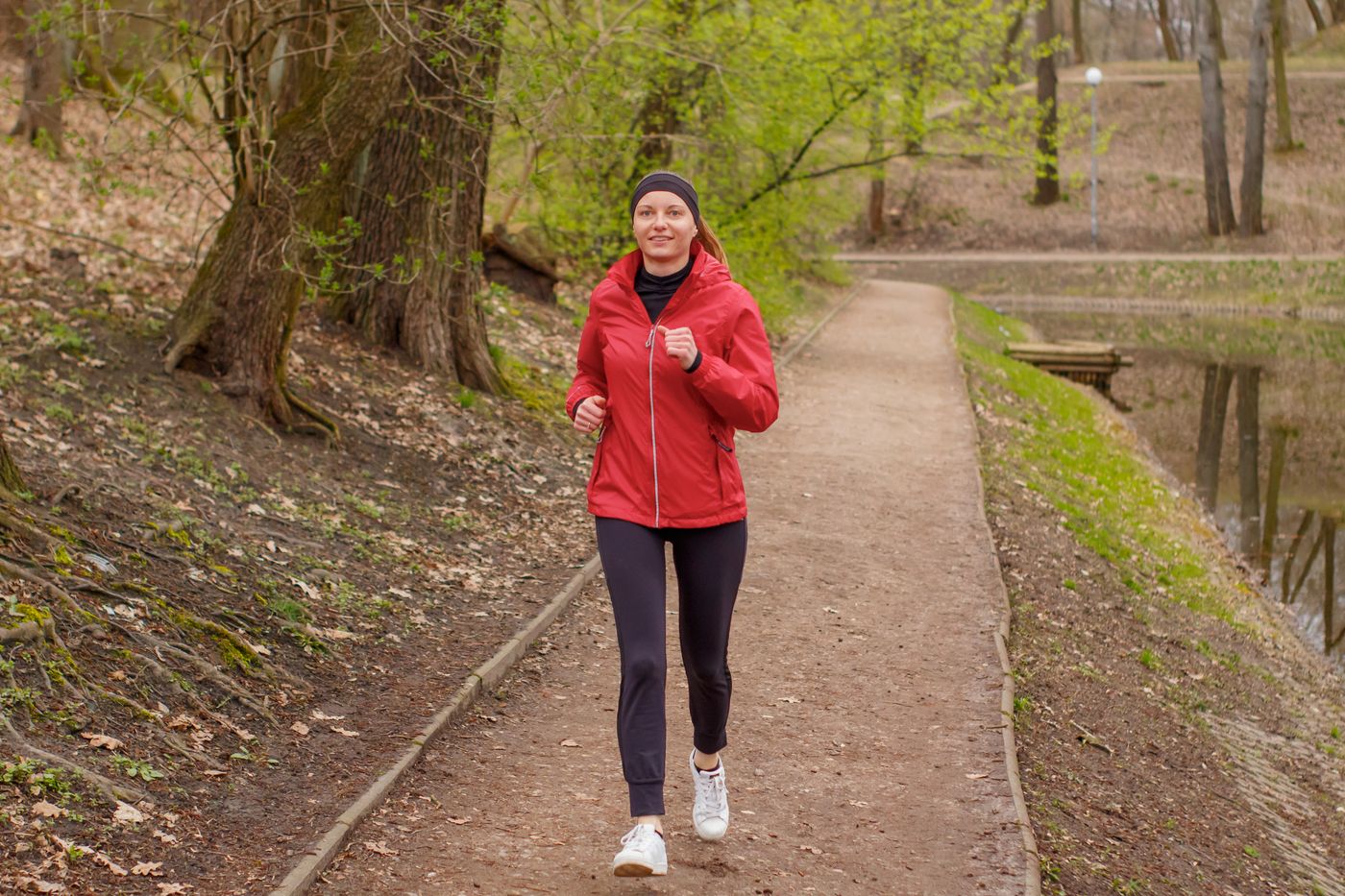 Runner jogging on a park path in Ottawa